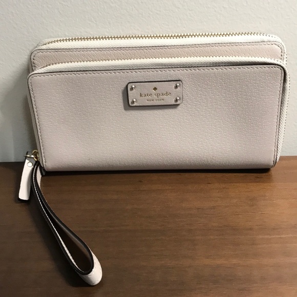 kate spade Handbags - kate spade wristlet gold trim
